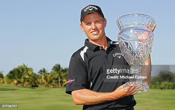 Derek Lamely holds the trophy after winning the Puerto Rico Open presented by Banco Popular at Trump International Golf Club held on March 15, 2010...