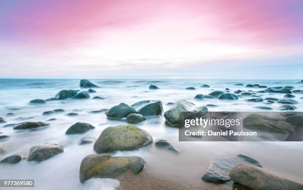 seascape with rocks at sunrise, halmstad, sweden - halmstad stock pictures, royalty-free photos & images