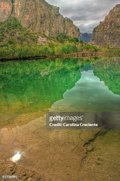 mountain reflected on emerald lake - mendoza province stock pictures, royalty-free photos & images