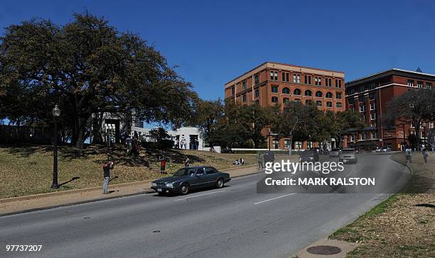 This photo taken on March 13 shows the Grassy Knoll and the former Texas School Book Depository Building in Dealey Plaza, where the 1963 assasination...