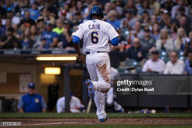 Lorenzo Cain of the Milwaukee Brewers scores a run in the second inning against the Philadelphia Phillies at Miller Park on June 15, 2018 in...