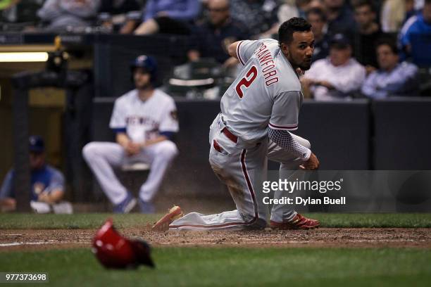 Crawford of the Philadelphia Phillies slides into home plate to score a run in the sixth inning against the Milwaukee Brewers at Miller Park on June...