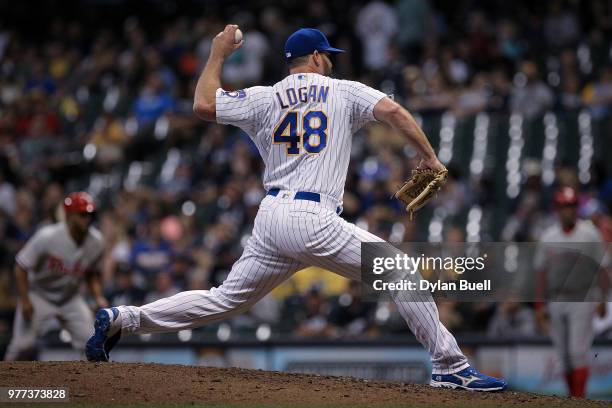 Boone Logan of the Milwaukee Brewers pitches in the ninth inning against the Philadelphia Phillies at Miller Park on June 15, 2018 in Milwaukee,...