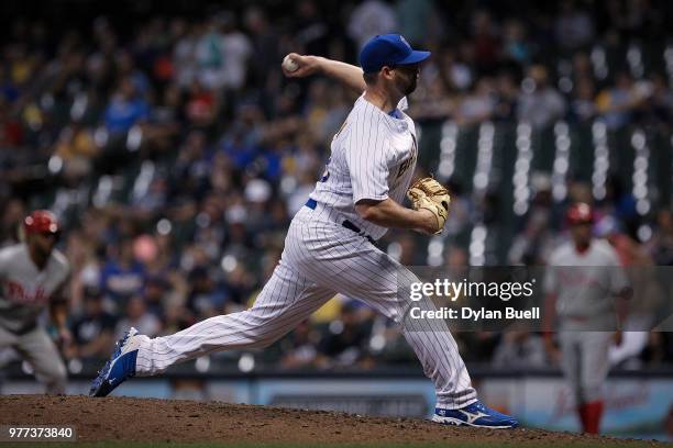 Boone Logan of the Milwaukee Brewers pitches in the ninth inning against the Philadelphia Phillies at Miller Park on June 15, 2018 in Milwaukee,...