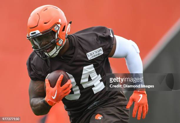 Running back Carlos Hyde of the Cleveland Browns carries the ball during a mandatory mini camp on June 12, 2018 at the Cleveland Browns training...
