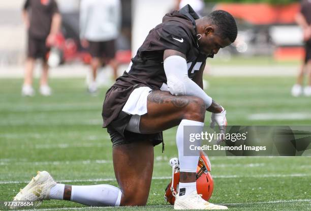 Wide receiver Josh Gordon of the Cleveland Browns kneels on the field during a mandatory mini camp on June 12, 2018 at the Cleveland Browns training...