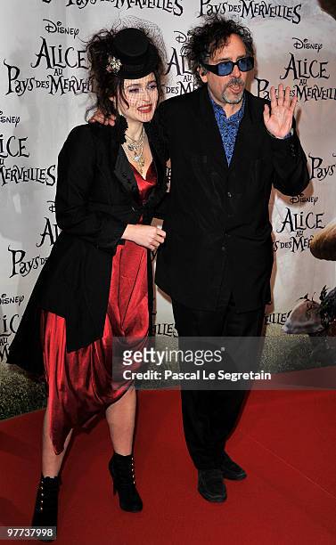 Director Tim Burton and ctress Helena Bonham Carter arrive for the premiere of Burton's film "Alice au pays des merveilles" at Theatre Mogador on...