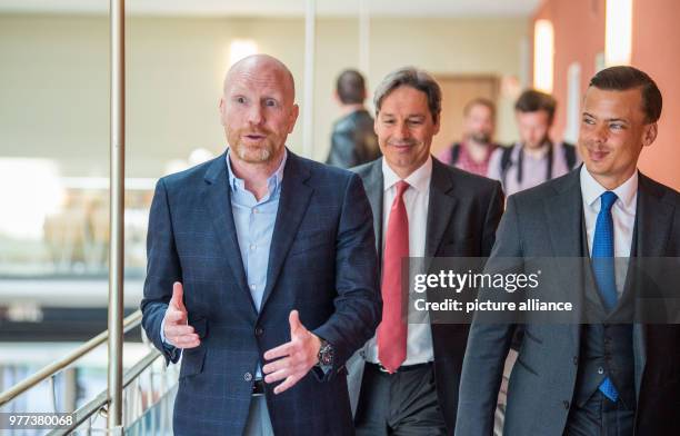 May 2018, Germany, Munich: The defendant Matthias Sammer , former board member of FC Bayern Munich, leaves the court room with his lawyers Gerhard...