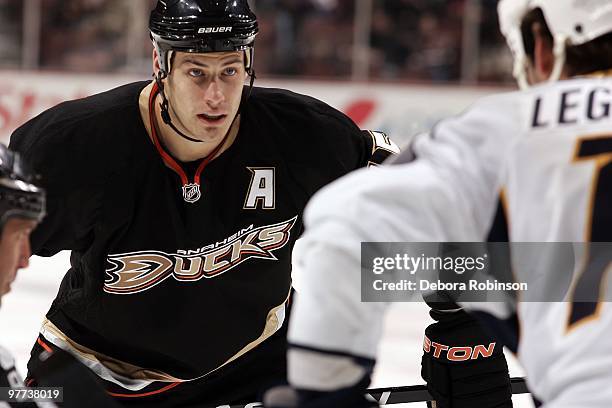 Ryan Getzlaf of the Anaheim Ducks faces off against David Legwand of the Nashville Predators during the game on March 12, 2010 at Honda Center in...