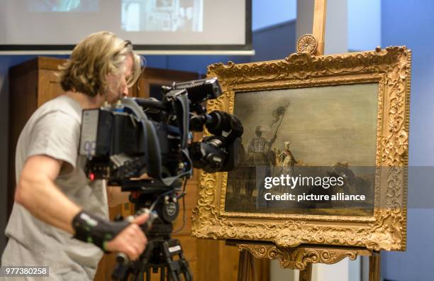 Dpatop - 07 May 2018, Germany, Munich: A cameraman films the painting 'Die Weiber von Weinsberg' by Gerrit Bleker in the course of a press conference...