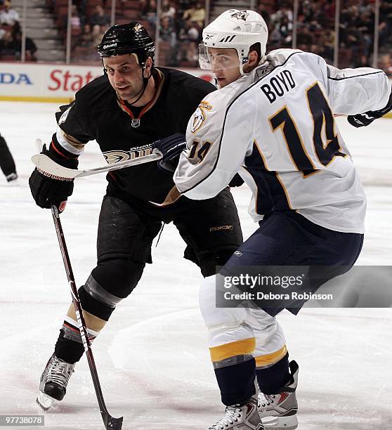 Kyle Chipchura of the Anaheim Ducks defends against Dustin Boyd of the Nashville Predators during the game on March 12, 2010 at Honda Center in...