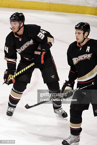 James Wisniewski and Ryan Getzlaf of the Anaheim Ducks defend against the Nashville Predators during the game on March 12, 2010 at Honda Center in...