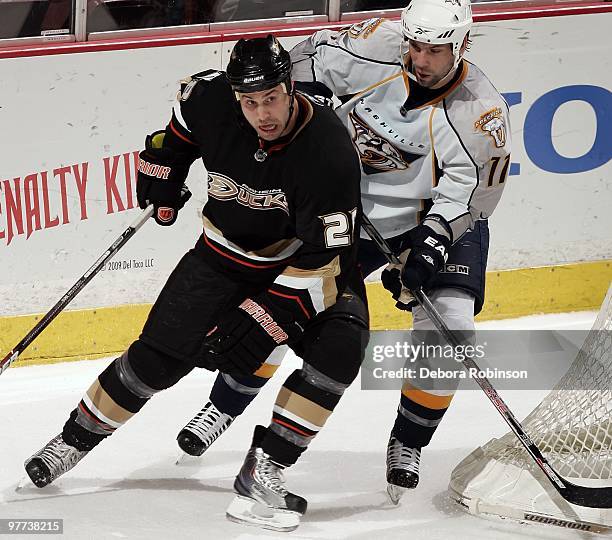 Kyle Chipchura of the Anaheim Ducks battles coming around the net against David Legwand of the Nashville Predators during the game on March 12, 2010...