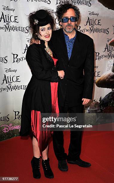 Director Tim Burton and actress Helena Bonham Carter arrive for the premiere of Burton's film "Alice au pays des merveilles" at Theatre Mogador on...