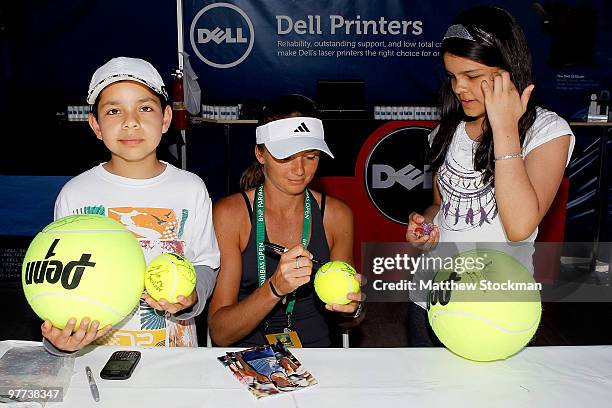 Daniela Hantuchova of Slovakia signs autographs and poses for photographs during the BNP Paribas Open on March 15, 2010 at the Indian Wells Tennis...