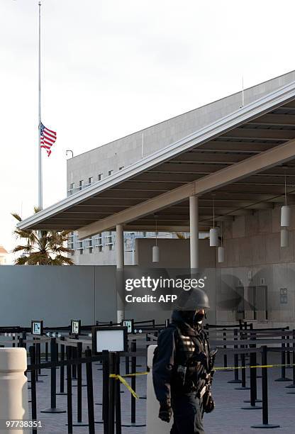 The US national flag flutters at half-mast at the entrance of the consulate of the United States in Ciudad Juarez, Chihuahua state, Mexico on March...