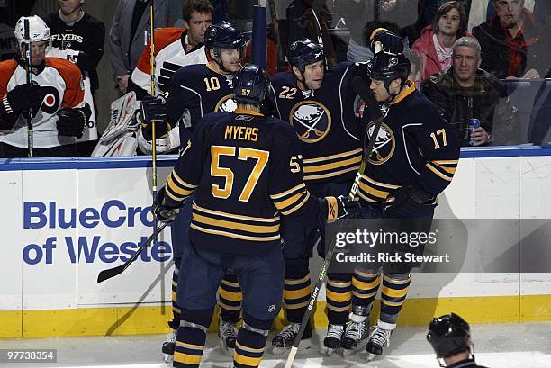 Adam Mair of the Buffalo Sabres celebrates a goal with teammates Henrik Tallinder, Tyler Myers and Raffi Torres during the game against the...