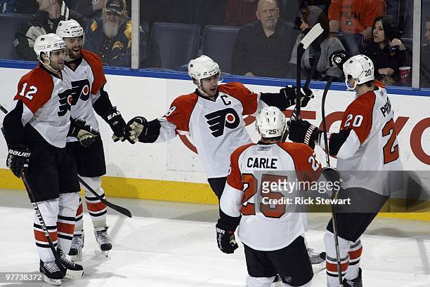 Mike Richards of the Philadelphia Flyers celebrates a goal with teammates Simon Gagne, Ville Leino, Matt Carle and Chris Pronger during the game...