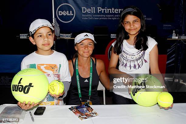 Daniela Hantuchova of Slovakia signs autographs and poses for photographs during the BNP Paribas Open on March 15, 2010 at the Indian Wells Tennis...