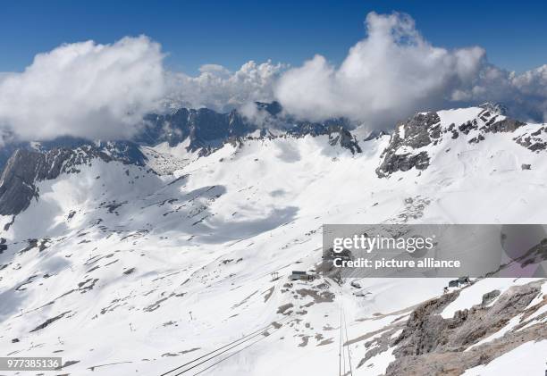May 2018, Germany, Garmisch-Partenkirchen: Clouds gather over the ski area of the Zugspitze. What a sight: politicians are gathering on Germany's...
