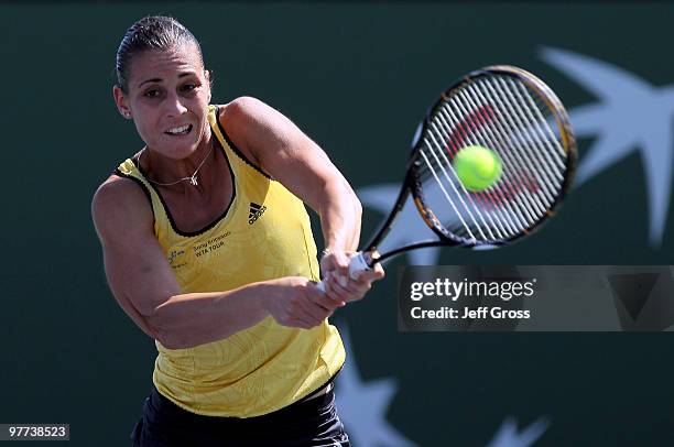 Flavia Pennetta of Italy returns a backhand against Shahar Peer during the BNP Paribas Open at the Indian Wells Tennis Garden on March 15, 2010 in...