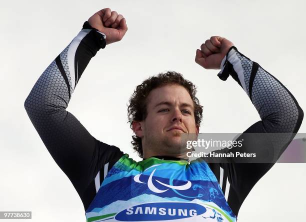 Adam Hall of New Zealand celebrates winning the Men's Slalom Standing event at the flower ceremony during day 4 of the Winter Paralympics at Whistler...