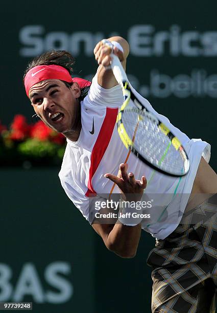 Rafael Nadal of Spain hits a serve against Mario Ancic during the BNP Paribas Open at the Indian Wells Tennis Garden on March 15, 2010 in Indian...