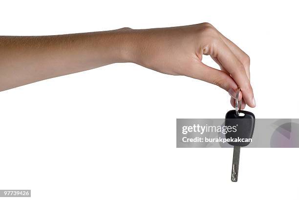woman holding car key, close-up - car keys hand stockfoto's en -beelden