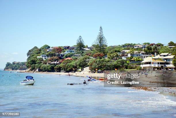 surf life saving new zealand flags, mairangi bay, auckland, new zealand - new zealand boats auckland stock pictures, royalty-free photos & images