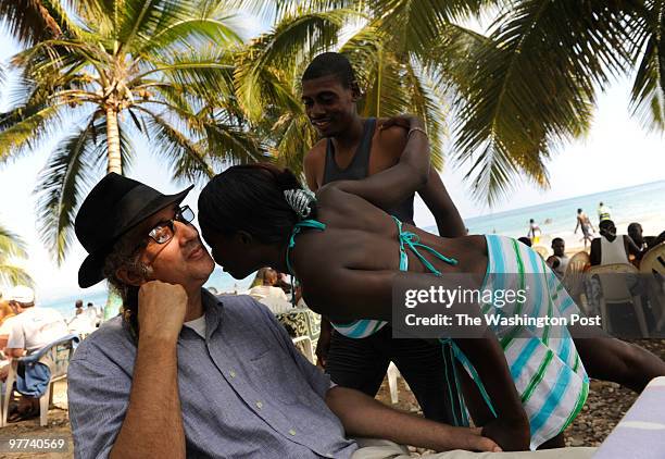 Richard Morse, known around town as "Papa Richard" is easily recognized by fans as he relaxes on Raymond Beach in Jacmel, Haiti, on Sunday, February...