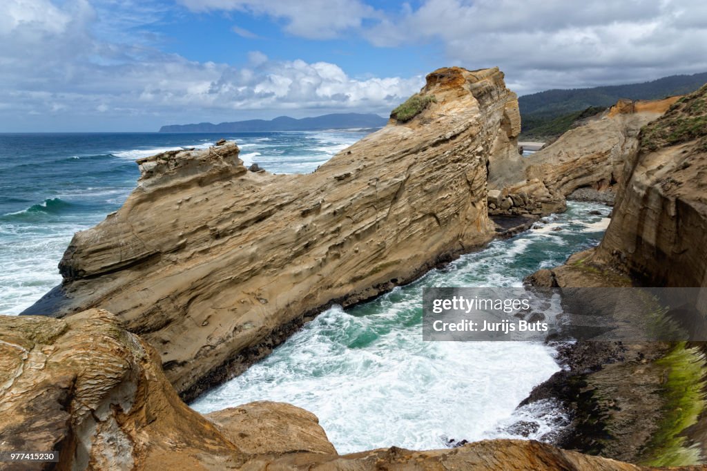 Waves crashing against rocky coastline, Cape Kiwanda, Oregon, USA