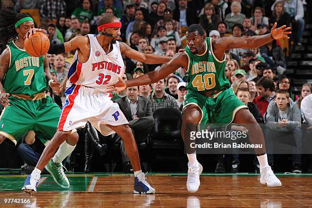 Michael Finley of the Boston Celtics reaches in for the ball against Richard Hamilton of the Detroit Pistons on March 15, 2010 at the TD Garden in...
