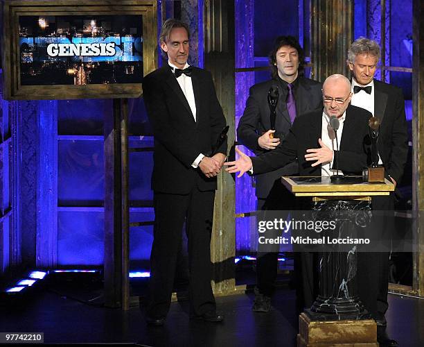 Inductees Mike Rutherford, Steve Hackett, Phil Collins and Tony Banks of Genesis speak onstage at the 25th Annual Rock And Roll Hall of Fame...