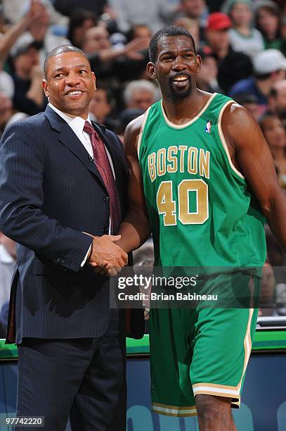 Michael Finley of the Boston Celtics shakes Head Coach, Doc Rivers' hand after a win against the Detroit Pistons on March 15, 2010 at the TD Garden...