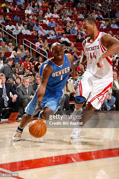 Chauncey Billups of the Denver Nuggets drives the ball past Chuck Hayes of the Houston Rockets on March 15, 2010 at the Toyota Center in Houston,...