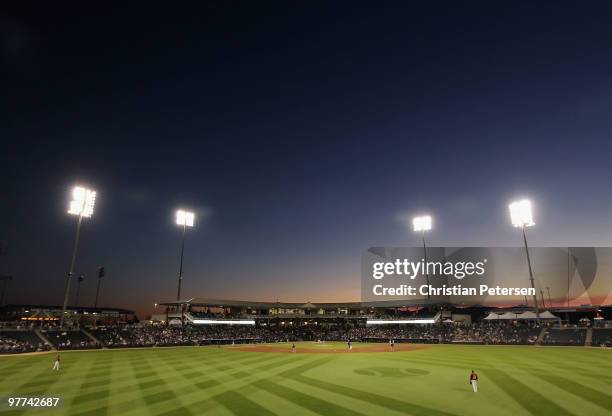 General view of action between the San Francisco Giants and the Texas Rangers during the MLB spring training game at Surprise Stadium on March 15,...
