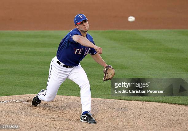 Starting pitcher Rich Harden of the Texas Rangers pitches against the San Francisco Giants during the MLB spring training game at Surprise Stadium on...