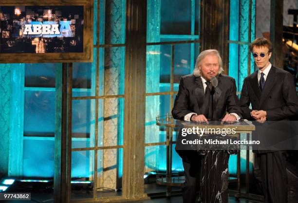 Musicians Robin Gibb and Barry Gibb speak onstage at the 25th Annual Rock And Roll Hall of Fame Induction Ceremony at the Waldorf=Astoria on March...