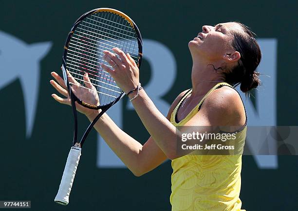 Flavia Pennetta of Italy reacts after loosing a point to Shahar Peer of Israel during the BNP Paribas Open at the Indian Wells Tennis Garden on March...