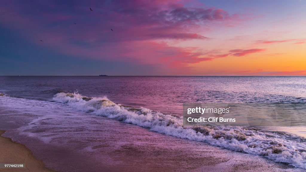 Atlantic Ocean waves at sunrise, Delaware, USA