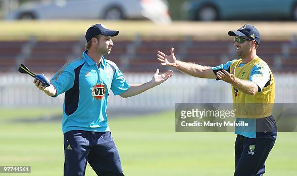 Phil Hughes and Simon Katich of Australia have a difference of opinion during an Australian Training Session at Basin Reserve on March 16, 2010 in...