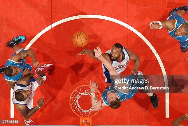Baron Davis of the Los Angeles Clippers puts up a shot against Darius Songaila of the New Orleans Hornets at Staples Center on March 15, 2010 in Los...