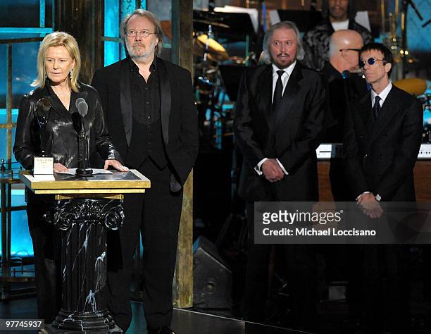 Anni-Frid Princessan Reuss and Benny Andersson of ABBA speak onstage as Barry Gibb and Robin Gibb look on at the 25th Annual Rock And Roll Hall of...