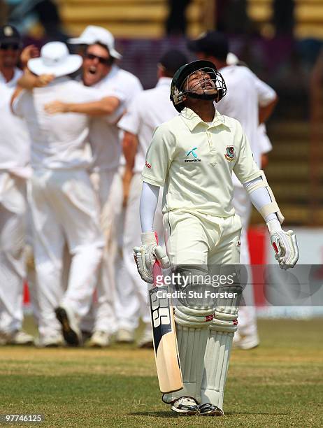 England bowler Graeme Swann celebrates with team mates after taking the wicket of Bangladesh batsman Mushfiqur Rahim for 95 runs during day five of...