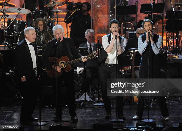 Inductees Allan Clarke and Graham Nash of the Hollies perform with Adam Levine and Jesse Carmichael of Maroon 5 onstage at the 25th Annual Rock And...