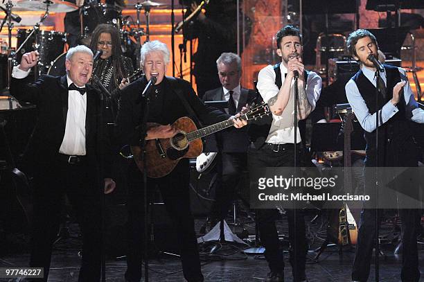 Inductees Allan Clarke and Graham Nash of the Hollies perform with Adam Levine and Jesse Carmichael of Maroon 5 onstage at the 25th Annual Rock And...