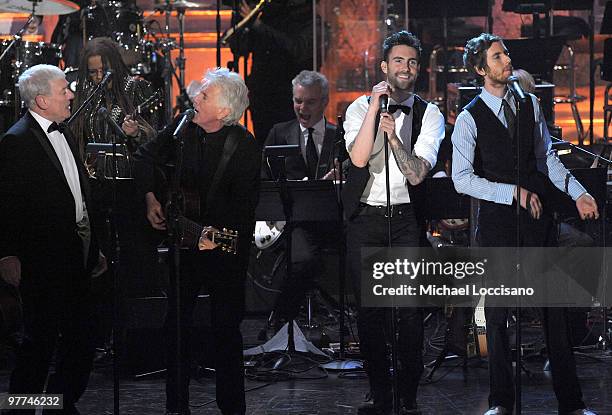 Inductees Allan Clarke and Graham Nash of the Hollies perform with Adam Levine and Jesse Carmichael of Maroon 5 onstage at the 25th Annual Rock And...