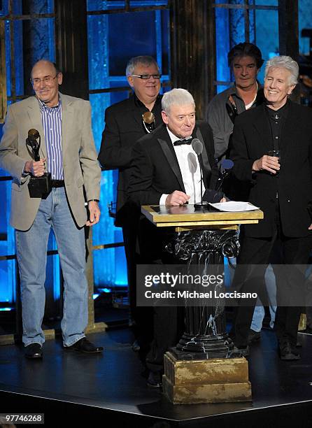 Inductees Bernie Calvert, Eric Haydock, Allan Clarke, Terry Sylvester and Graham Nash of the Hollies speak onstage at the 25th Annual Rock And Roll...