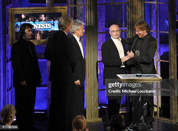 Inductee Phil Collins of Genesis speaks onstage with musician Trey Anastasio of Phish at the 25th Annual Rock and Roll Hall of Fame Induction...