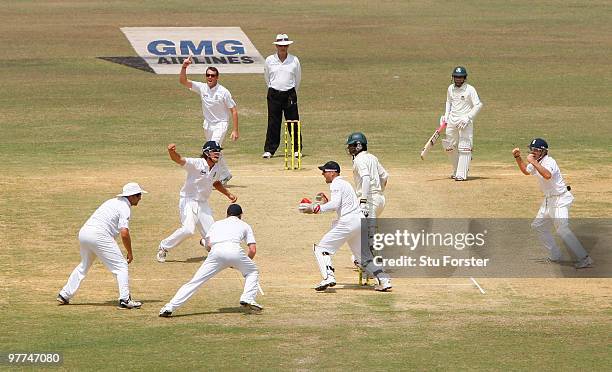 Graeme Swann tof England takes the wicket of Junaid Siddique Bangladesh for 106 runs caught by Paul Collingwood during day five of the 1st Test match...